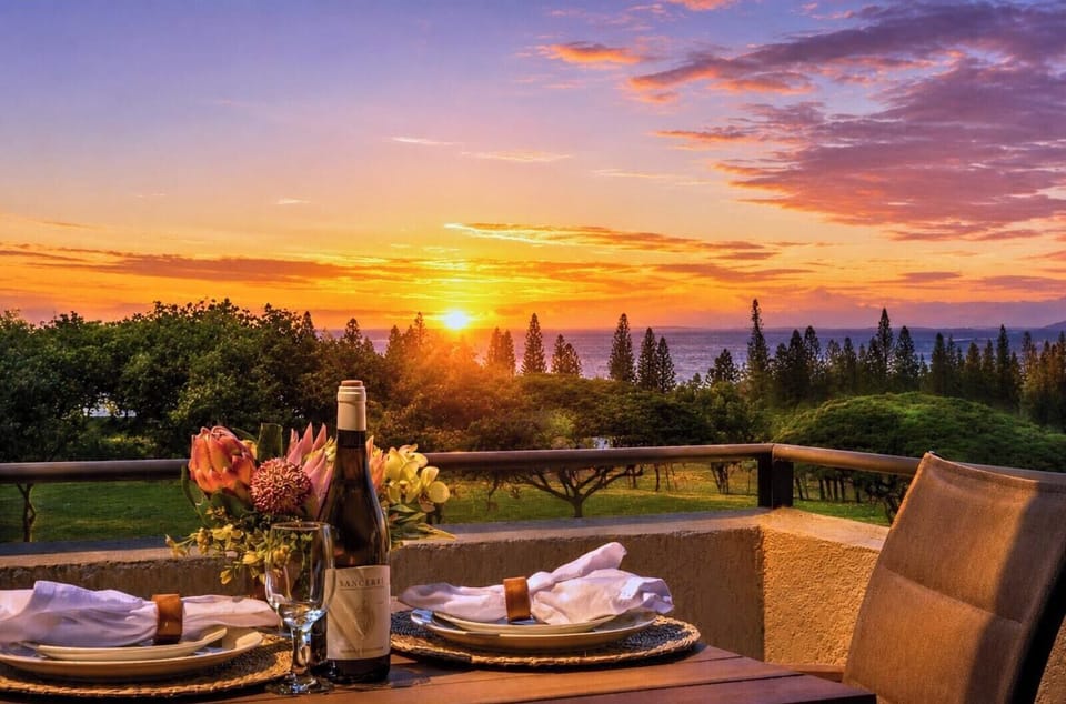 Sweeping sunset view over the Kapalua coastline, with the fairways and Pacific visible from your villa. KGV-18T4