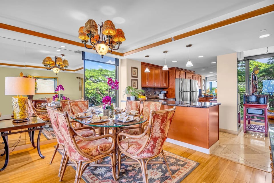 Gather around a beautifully appointed dining space featuring ornate chairs and a classic chandelier.