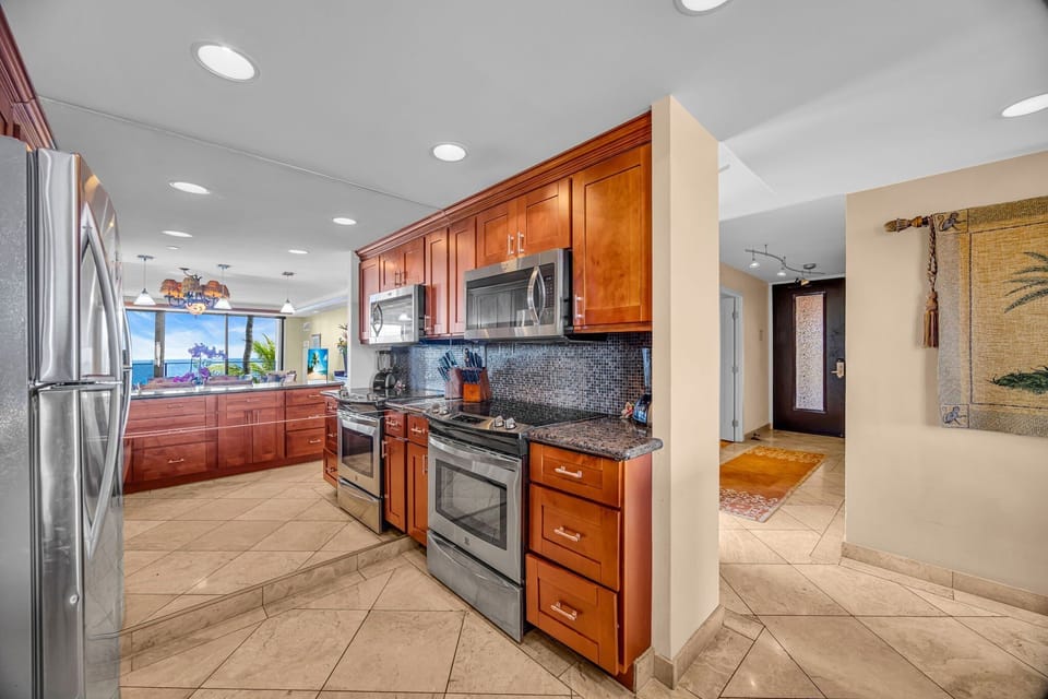 Prepare meals in a bright kitchen featuring stainless steel appliances