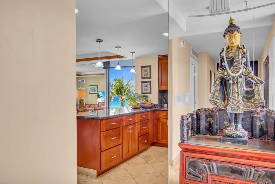 A welcoming space accented by a beautiful decorative statue and warm wood finishes