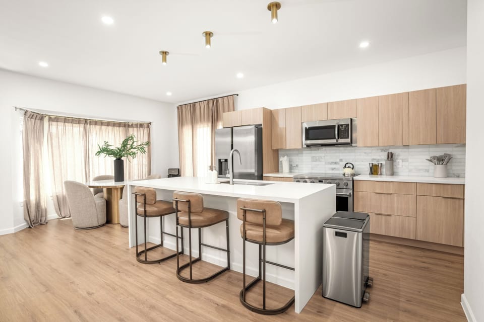 Light-filled kitchen and dining ideal for group meals, offering both comfort and