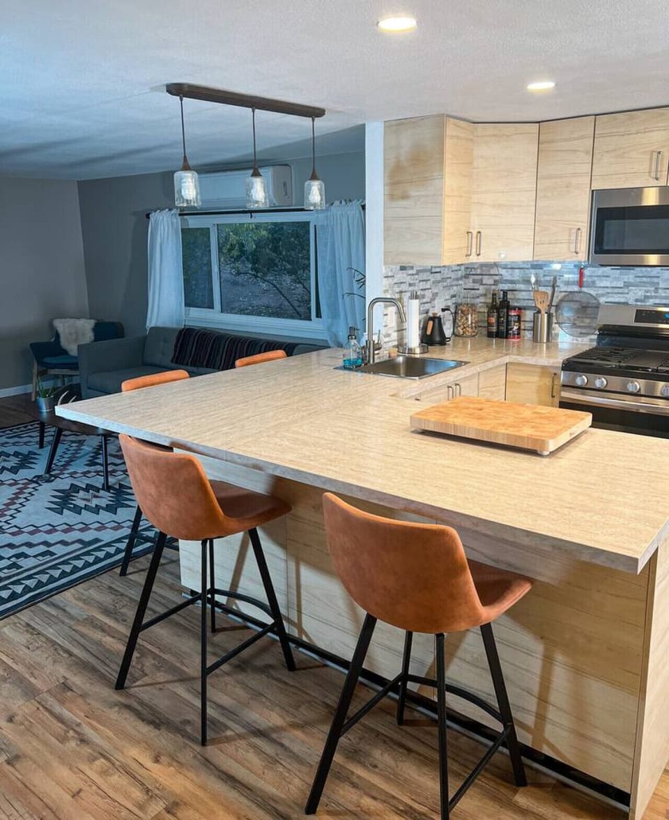 Breakfast, coffee, or a casual chat — all welcome at the kitchen bar.