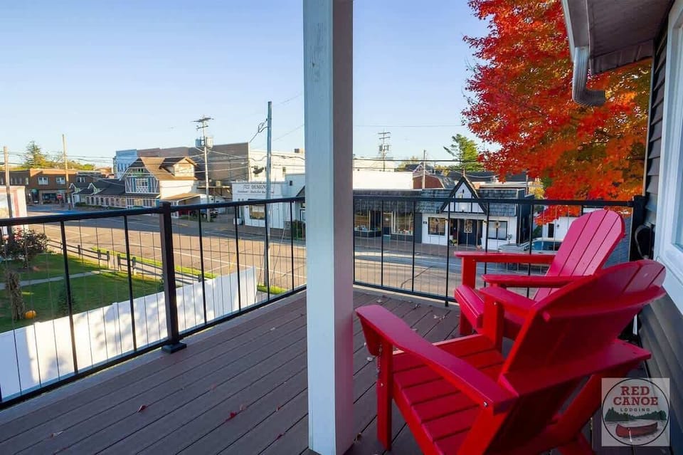 Second-floor balcony providing a charming outdoor retreat with fresh air and views of Minocqua and the Lake.
