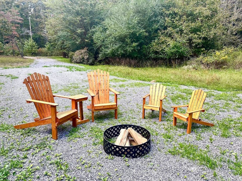 Firelight flickers, fresh air fills your lungs, and Adirondack chairs await—your perfect retreat. (Firewood not provided; please bring your own.)