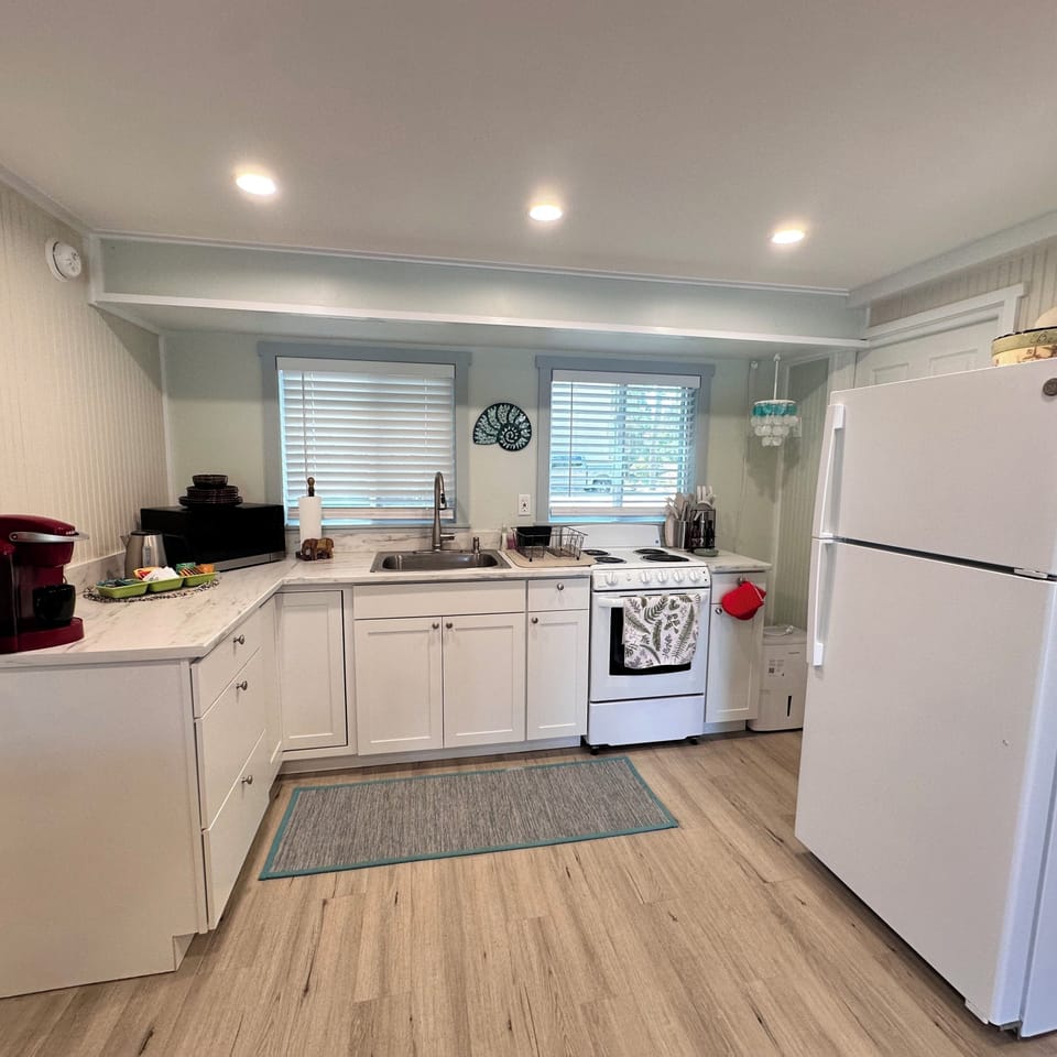 Full kitchen with all the essentials including coffee, tea, creamers & and more
