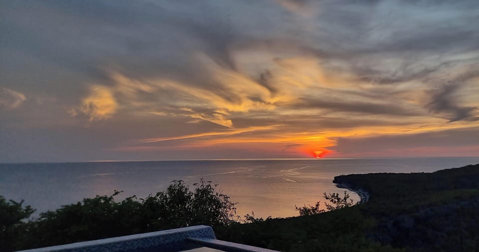 Sunset clouds lighting up the Caribbean horizon