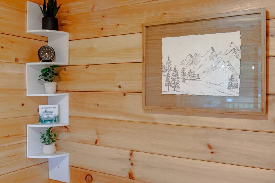 Rustic wall art & floating shelves adding charm to bedroom #2