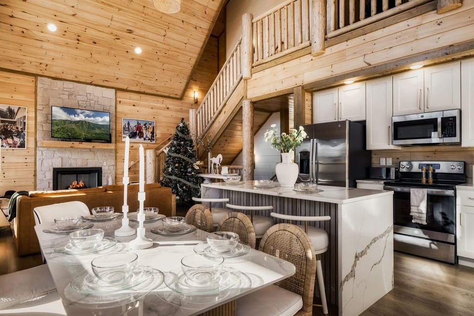 Gather in the open-concept kitchen and dining space, designed for cozy nights in.