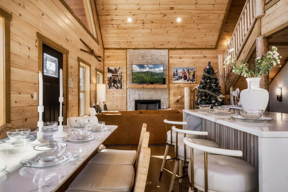 Open sightlines connect the kitchen, dining, and living spaces.