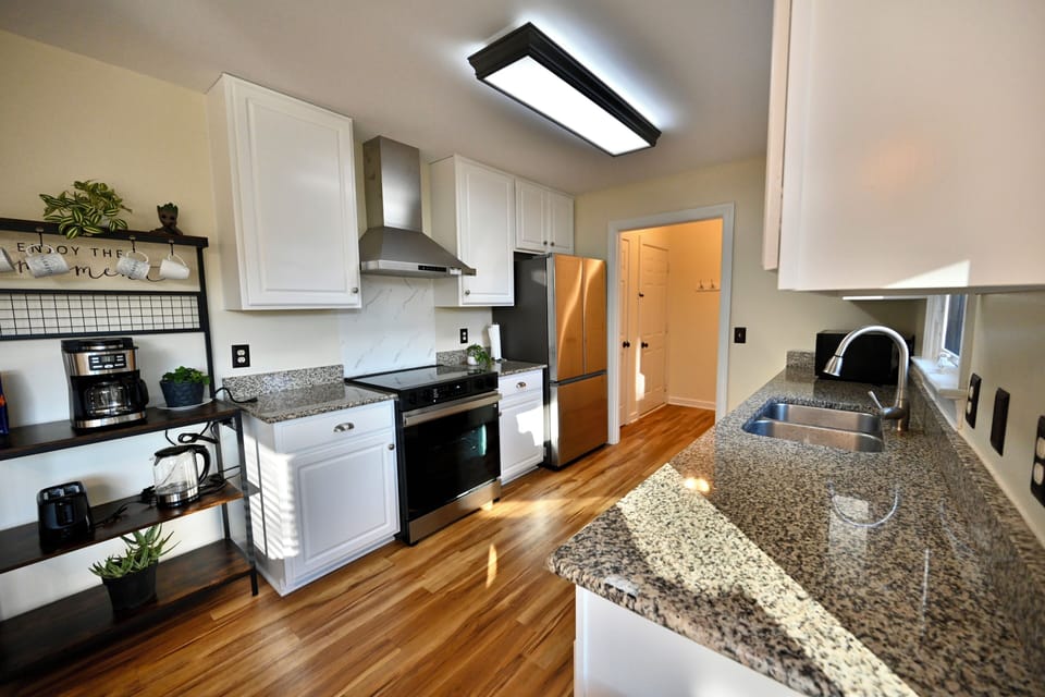 Modern kitchen with coffee station and stainless appliances