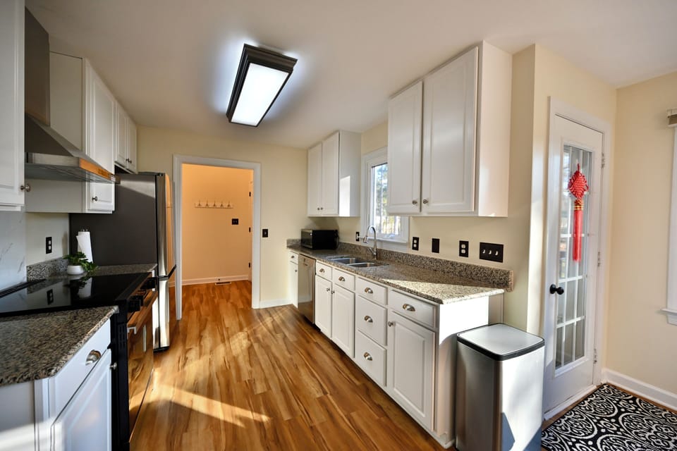 Well-equipped kitchen with granite counters and ample storage