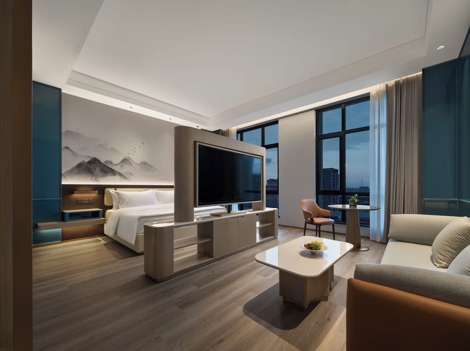 Superior Suite, River View | Desk, laptop workspace, blackout drapes, iron/ironing board