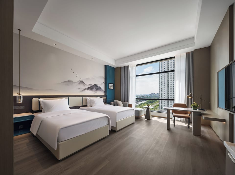 Standard Twin Room, River View | Desk, laptop workspace, blackout drapes, iron/ironing board