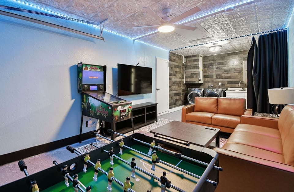 The game room is a hit with families and groups, featuring a flat-screen TV, PlayStation 5, and classic pinball machine for hours of entertainment and relaxation.