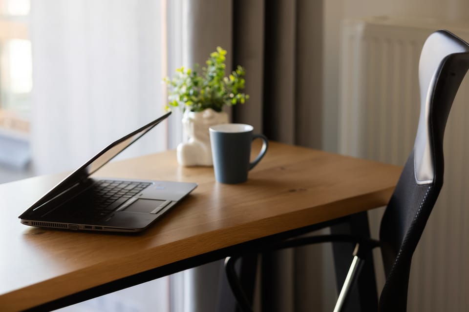 A desk by the window provides the perfect spot for remote work with natural light and an outside view.