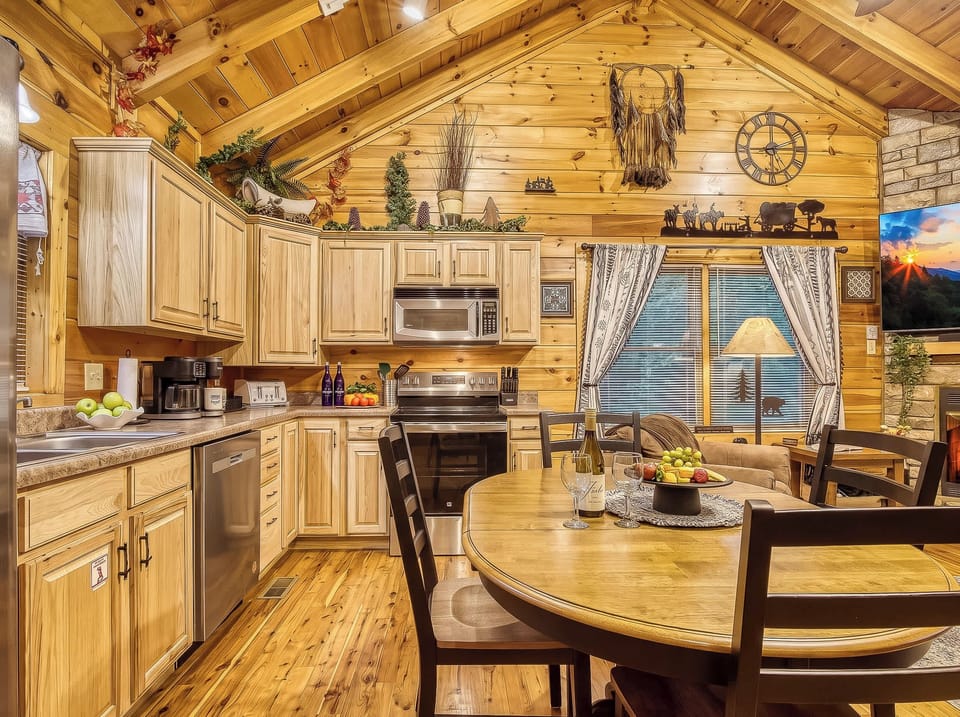 Cook with ease in the fully stocked kitchen and enjoy meals at the cozy dining table—ideal for family gatherings.