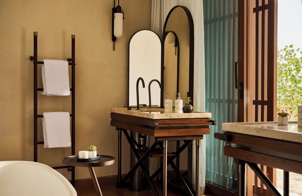 Separate tub and shower, rainfall showerhead, designer toiletries