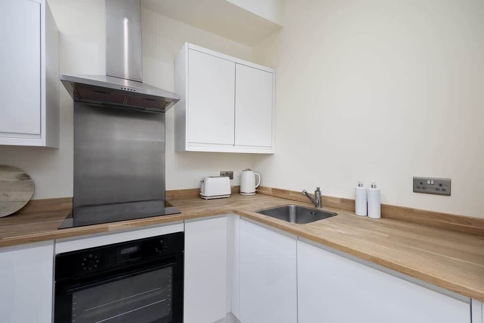 “Bright and well-equipped kitchen and dining area — a cozy spot to cook and unwind.”