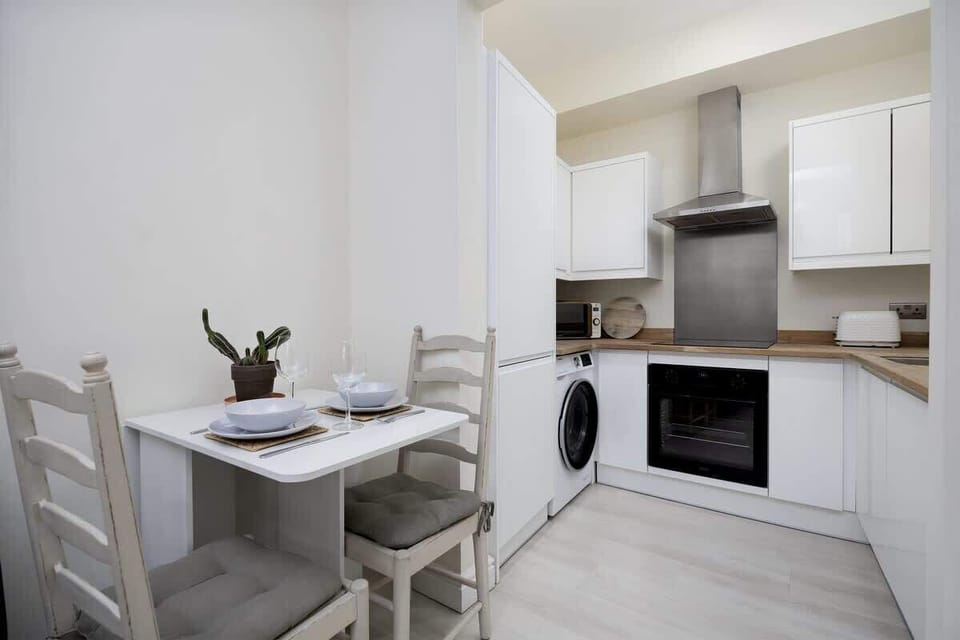 “Bright and well-equipped kitchen and dining area — a cozy spot to cook and unwind.”