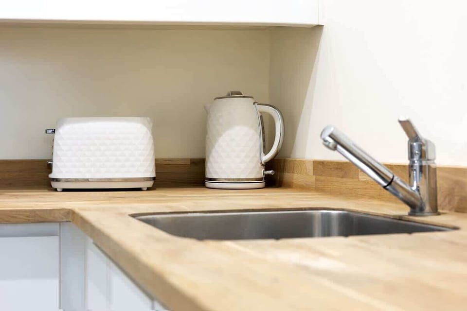 “Bright and well-equipped kitchen and dining area — a cozy spot to cook and unwind.”