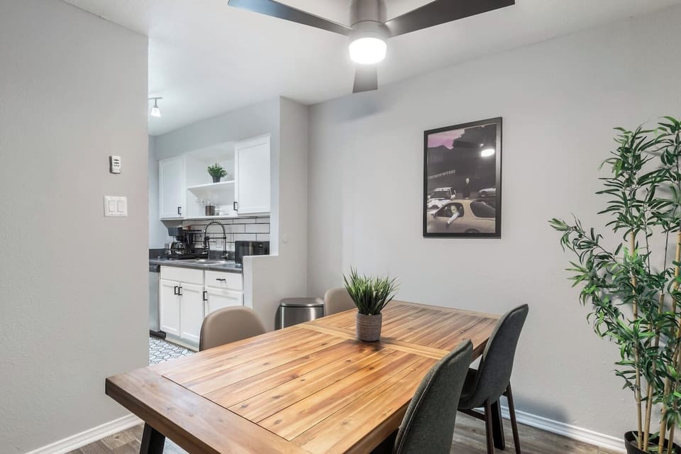 Spacious and inviting living area with comfortable seating and a smart TV, perfect for relaxing after exploring Arlington or attending events at AT&T Stadium.