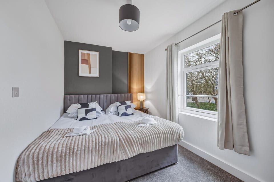 In the master bedroom, you’ll find a comfortable zip-and-link bed, prepared as two singles unless you request a king-size setup. Fresh linen and towels are included for your stay.