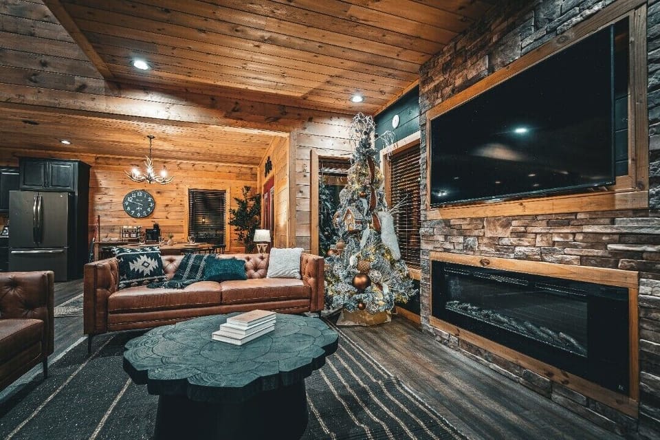 Get comfortable in this family room with a Smart TV and an electric fireplace!