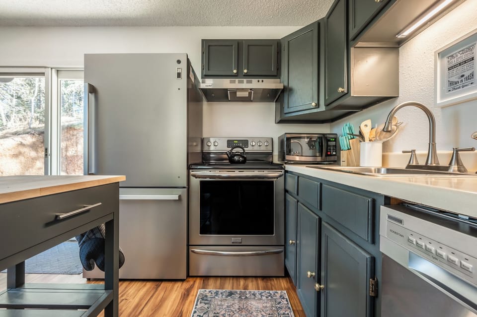 Gather, cook, and share meals in this cozy, complete kitchen.