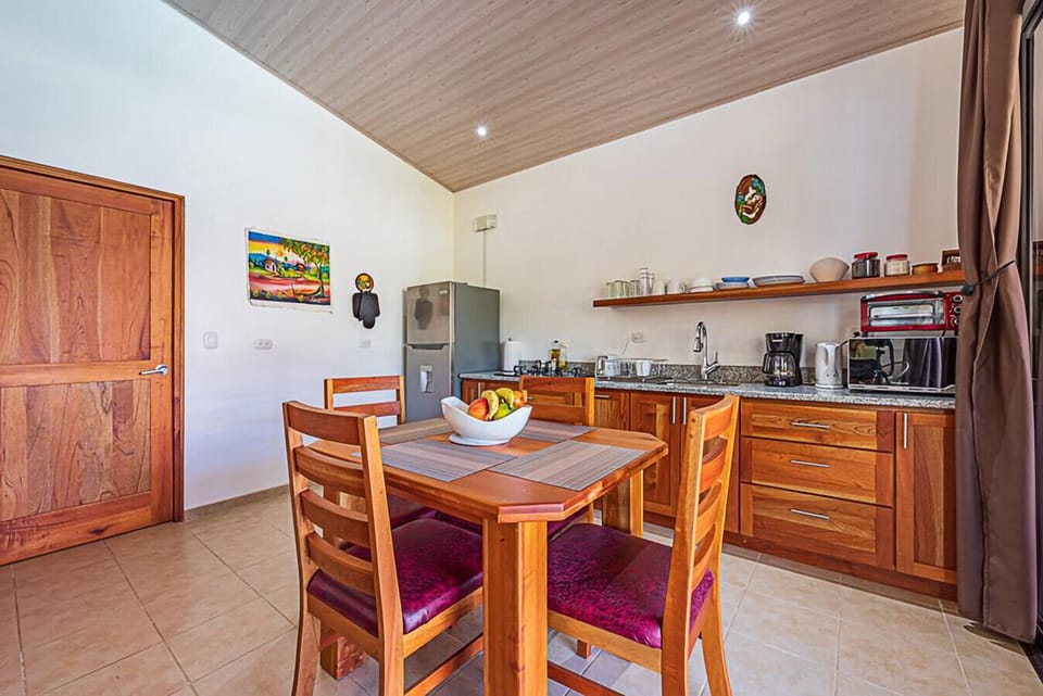 Enjoy a warm, inviting kitchen setup ideal for cooking and relaxing.