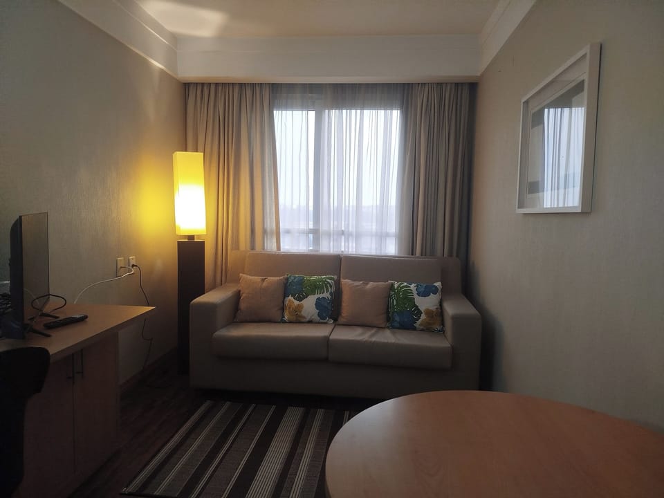 Comfort Studio, City View | Living room | TV