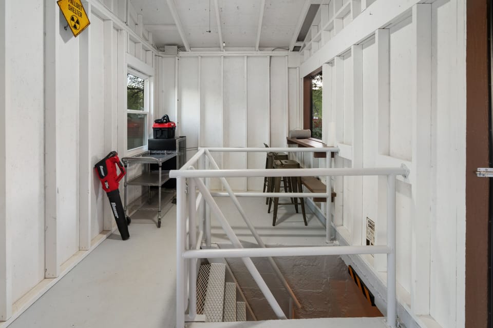 The Bunker Shed. Steps lead to the Bunker. Refrigerator in the shed. 