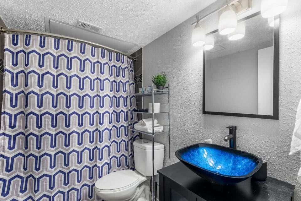 Clean and well-maintained bathroom stocked with essentials for a comfortable stay, ideal for refreshing after a day at AT&T Stadium.