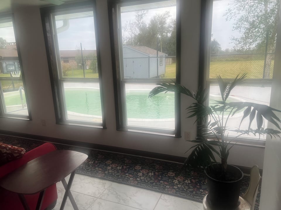 Pool area room looking outside 