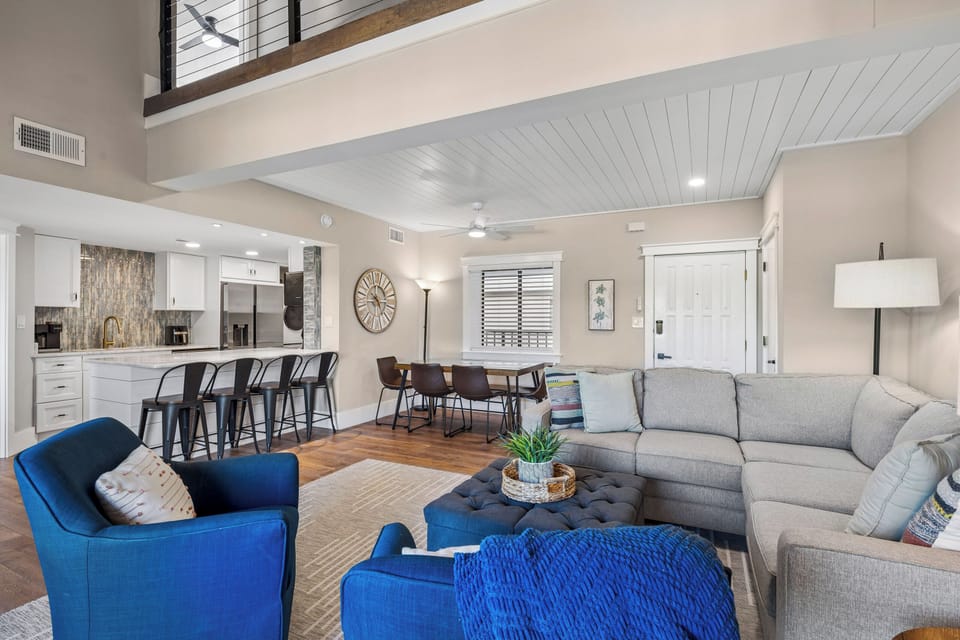 Spacious living area with outdoor views and a flatscreen tv.