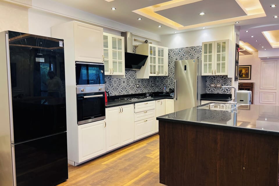 Duplex, Patio, Garden View | Private kitchen | Dining tables