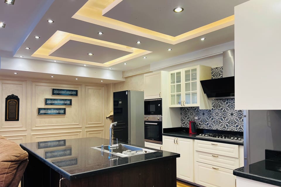 Duplex, Patio, Garden View | Private kitchen | Dining tables