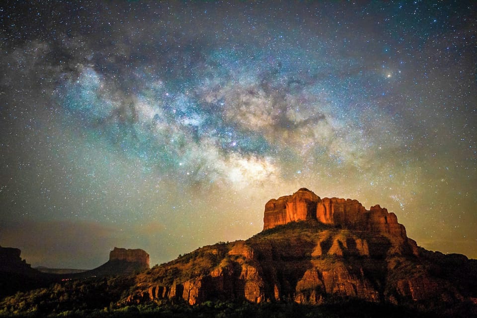 Count shooting stars beneath dazzling Milky Way from your oasis.
