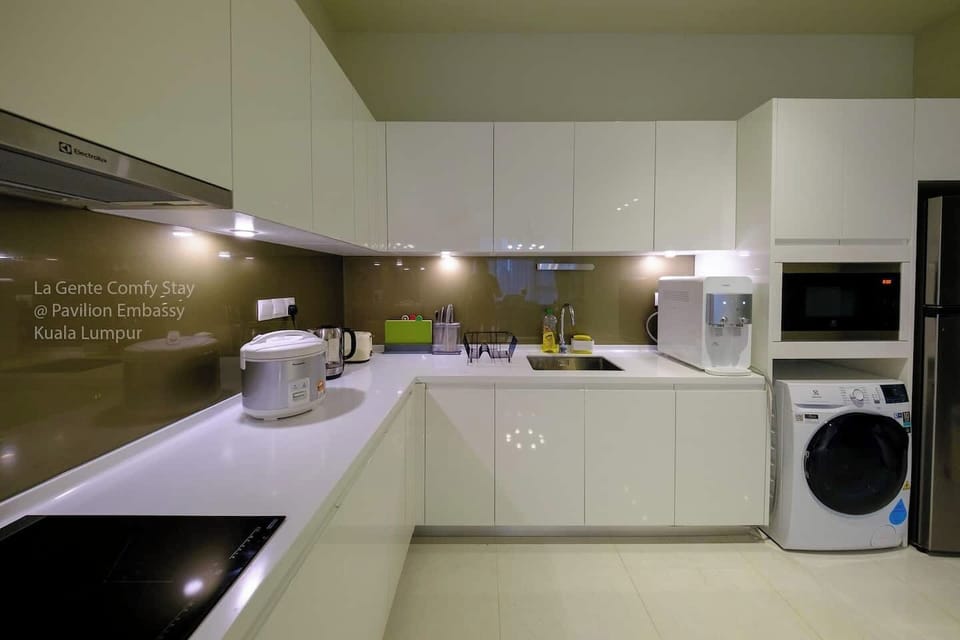 A full feature kitchen inclusive of 2 zones induction  cooker, full height refrigerator, microwave with grill function, plenty of storage cabinets and a wash basin. Washing machine with heater is also available here.