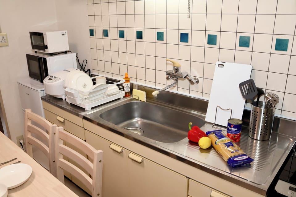 Basic Apartment, Multiple Beds, Balcony, City View | Private kitchen | Shared fridge, microwave