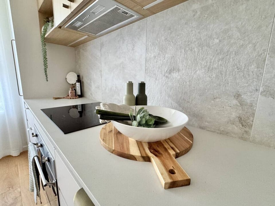 Enjoy the family sized kitchen with full size fridge, dishwasher, electric cooktop and oven, coffee machine, rice maker, sandwich press, NutriBullet, sharp knives, cutlery, crockery and everything nic nac a kitchen needs