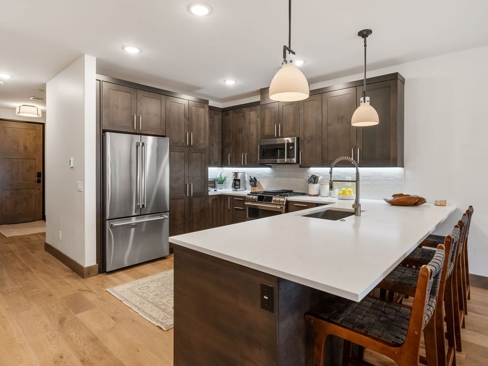 Kitchen with full-size appliances and breakfast bar