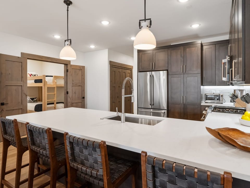 Kitchen with full-size appliances and breakfast bar