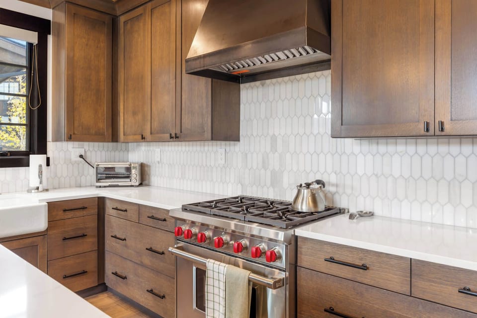 Kitchen (main floor): Drip coffee maker, Crockpot, blender, toaster oven, waffle maker, cooking utensils, tableware
