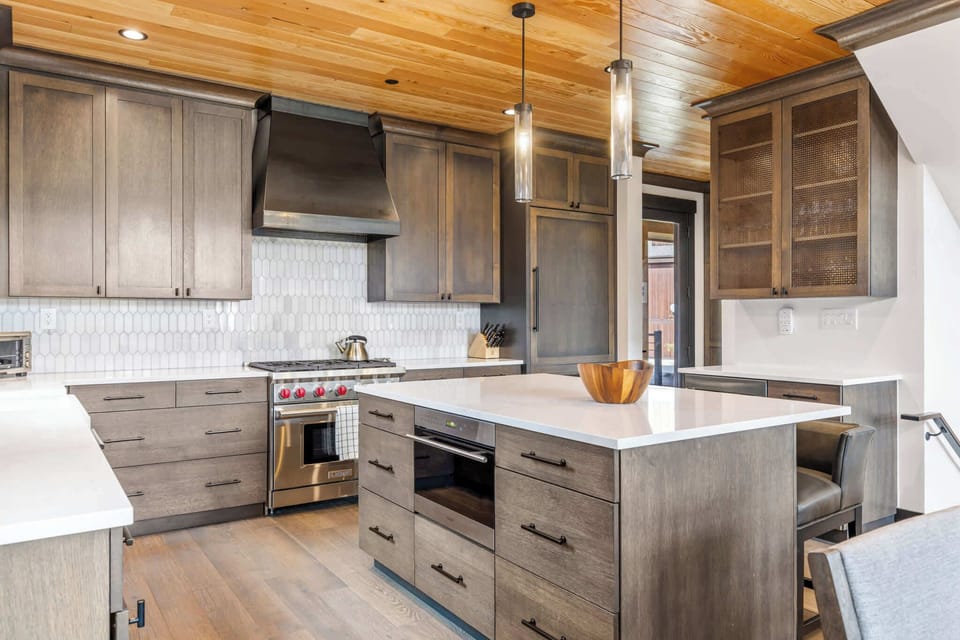 Kitchen (main floor): Drip coffee maker, Crockpot, blender, toaster oven, waffle maker, cooking utensils, tableware