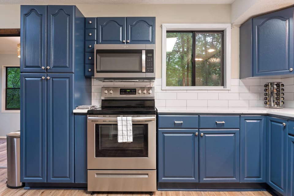 Microwave, stove and oven with counter prep space. 
