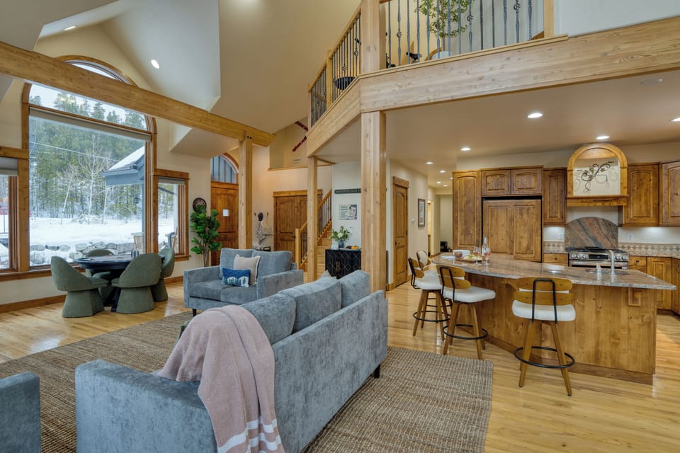 Open-concept living/dining with high ceilings and natural light.