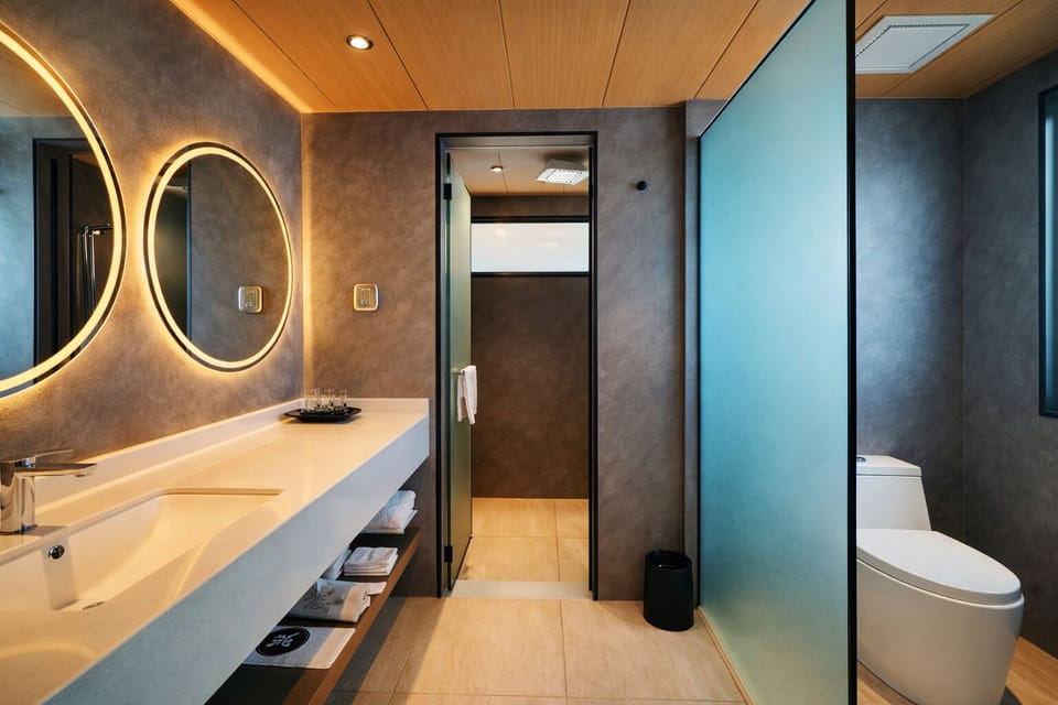 Shower, rainfall showerhead, designer toiletries, hair dryer