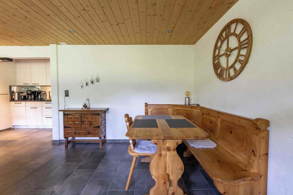 Dining area with rustic wooden table and alpine details
