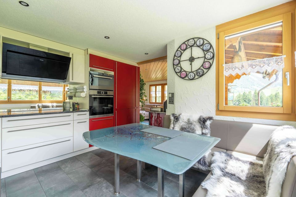 Bright kitchen and dining area with large windows

