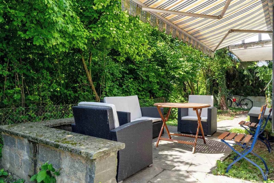 Covered outdoor lounge area in the garden